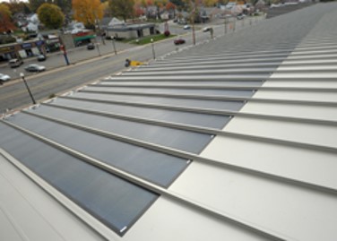 Solar panels cover a portion of the roof on the McPherson Field house