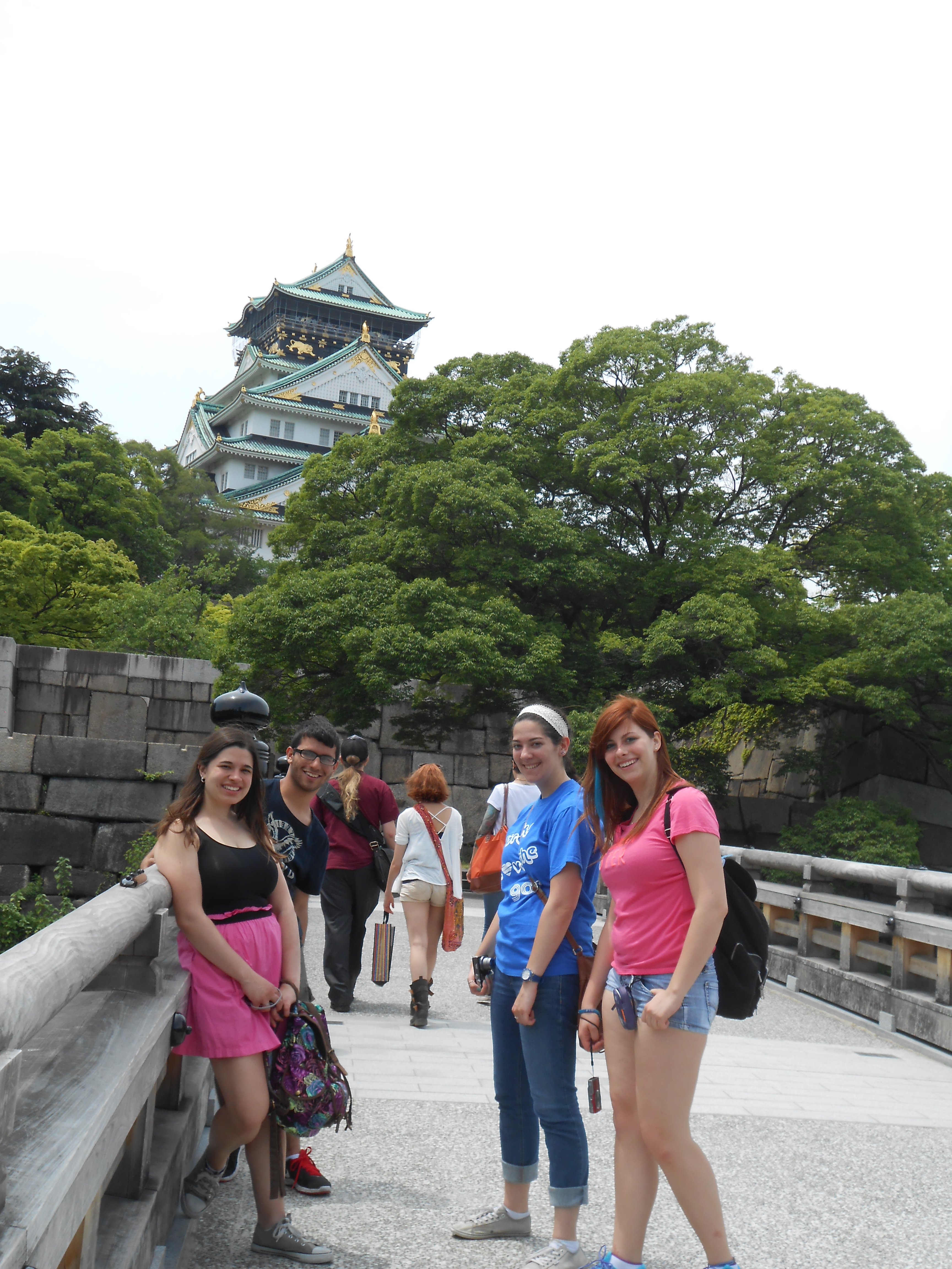 Students on bridge in front of Japanese castle