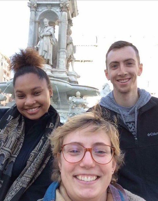Three students in front of statue in Lyon France