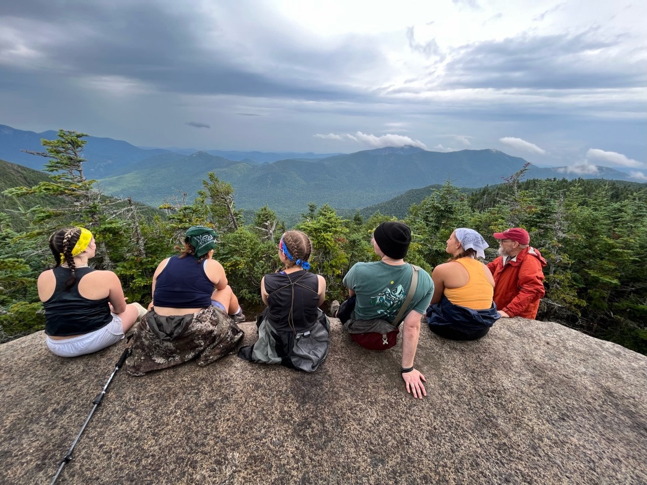 Students on Wilderness Trip, sitting on giant boulder