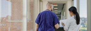 Nursing Students walking and talking down a hallway