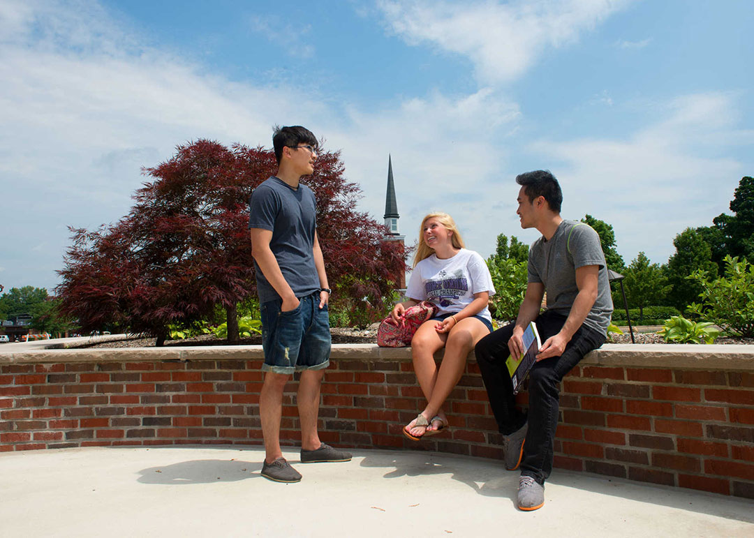 Students sitting on Mount Union's campus.