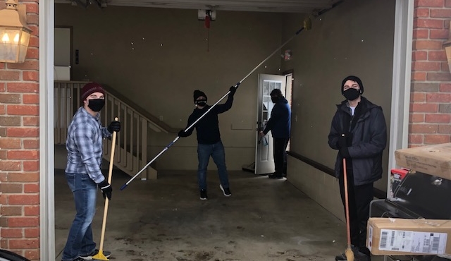 students cleaning garage