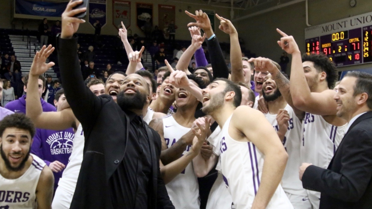 Mount Union basketball team celebration with Mike Gregg
