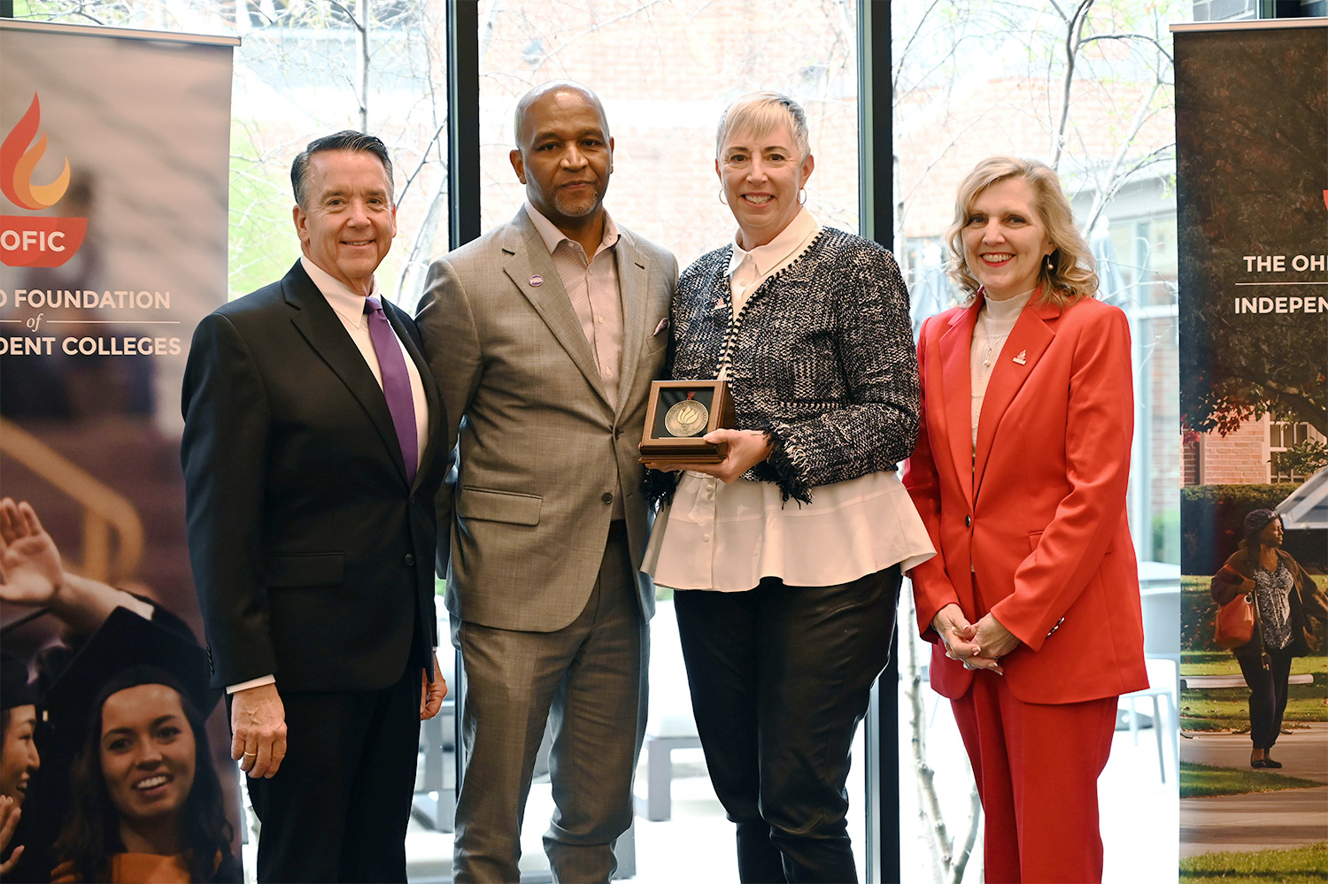 posed from left to right include ofic president, greg king, nancy hill, and ofic member