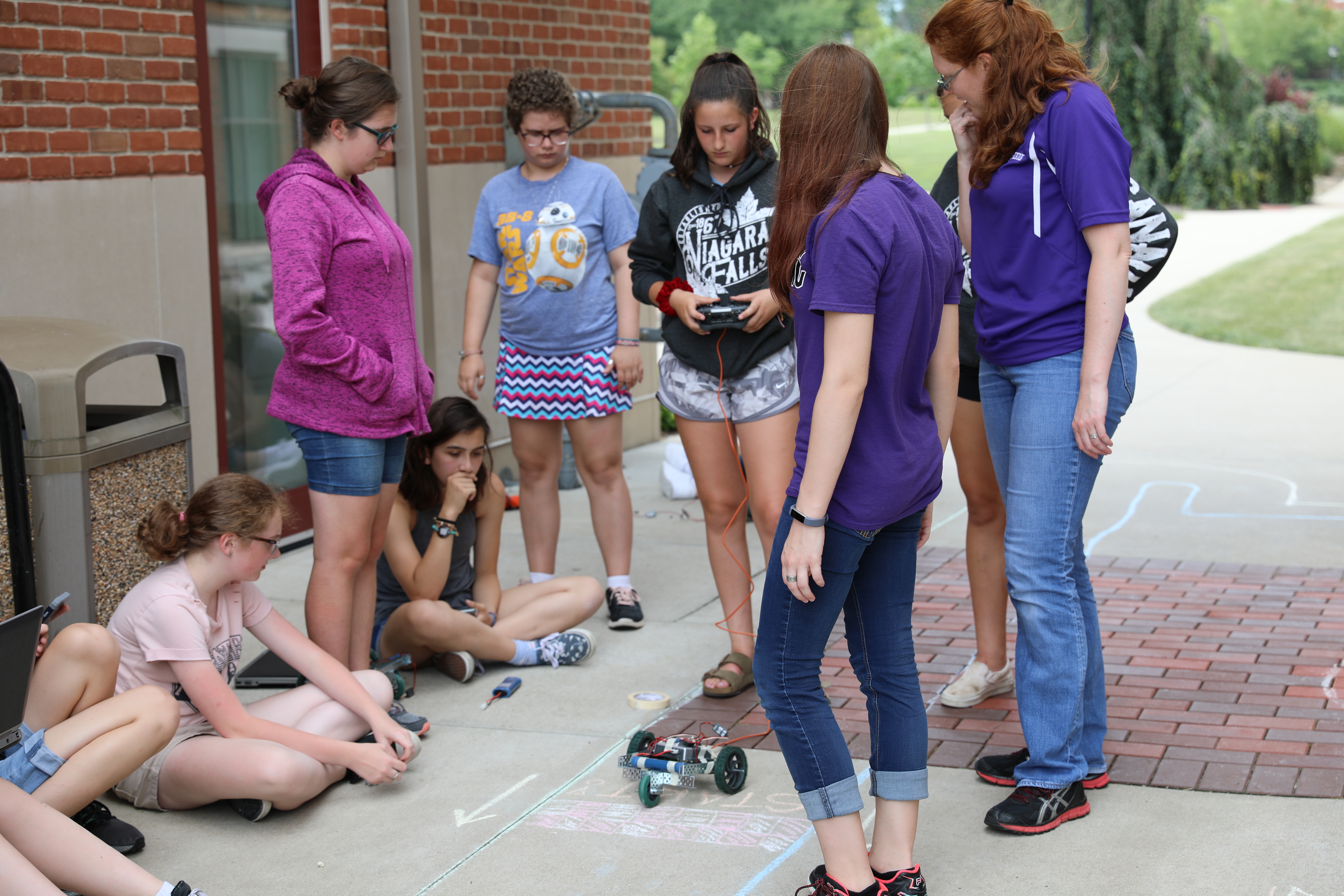 Action shot of the “Robot Design Challenge” where campers built their own robot car and programmed the car to race through an obstacle course in a timed competition