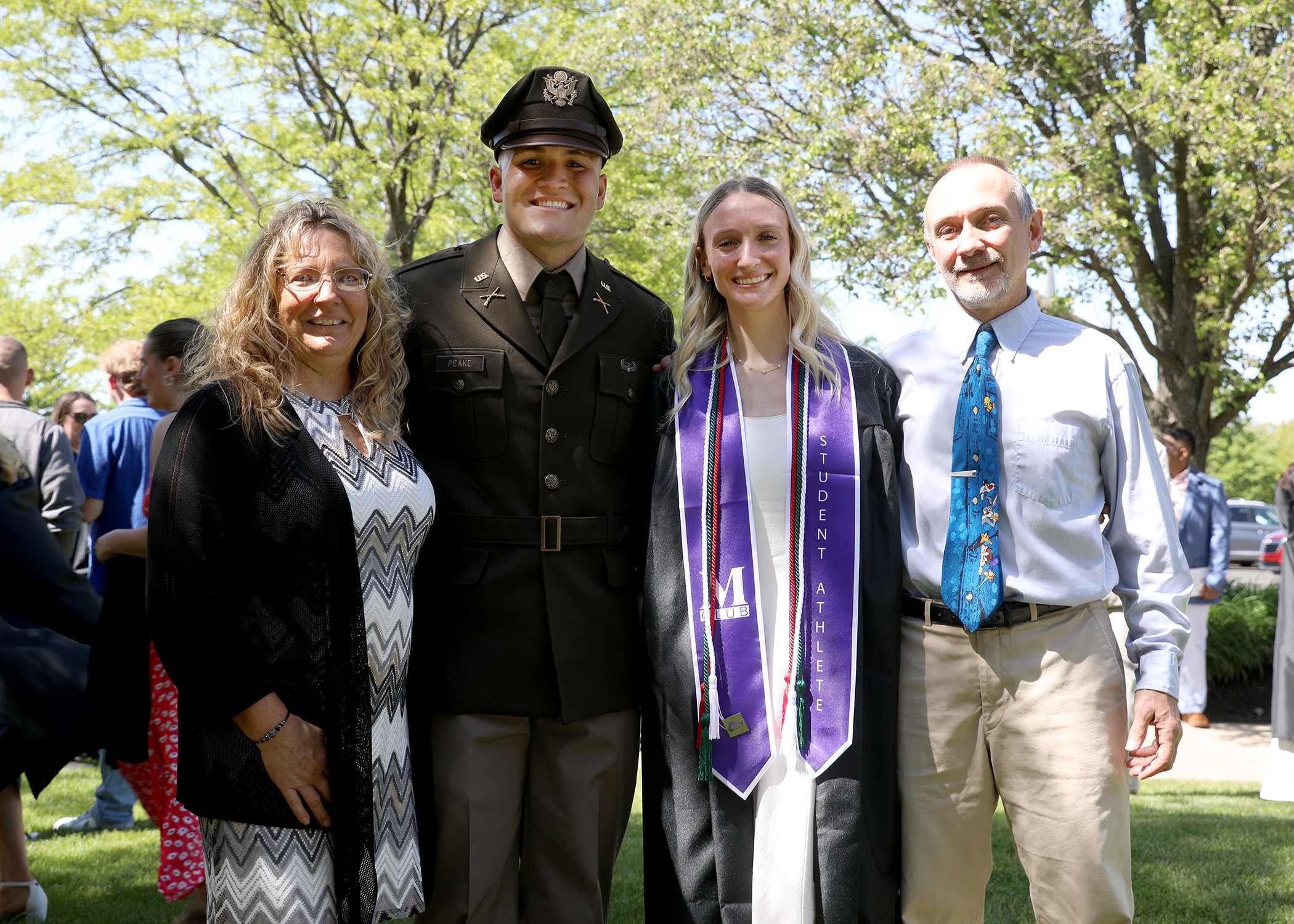 family posing with mount union graduate