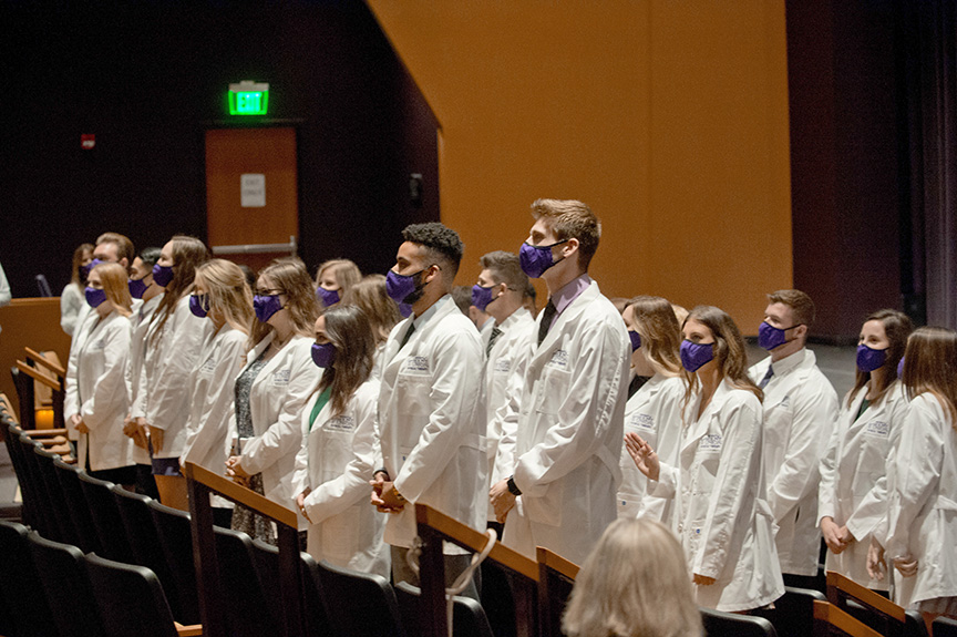 PT students standing at their White Coat Ceremony