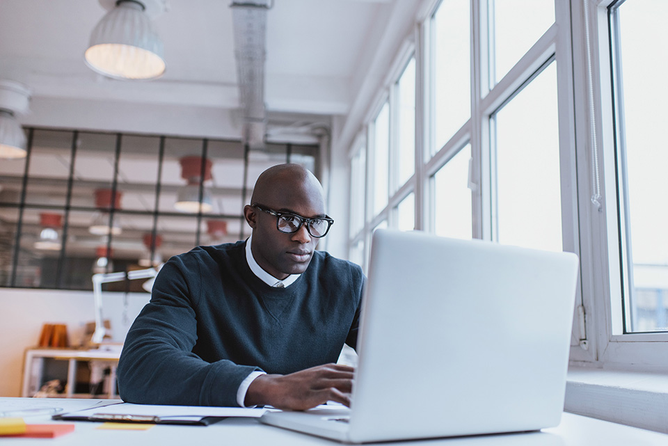 MBA Student studying at a computer