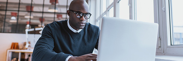 MBA Student studying at computer