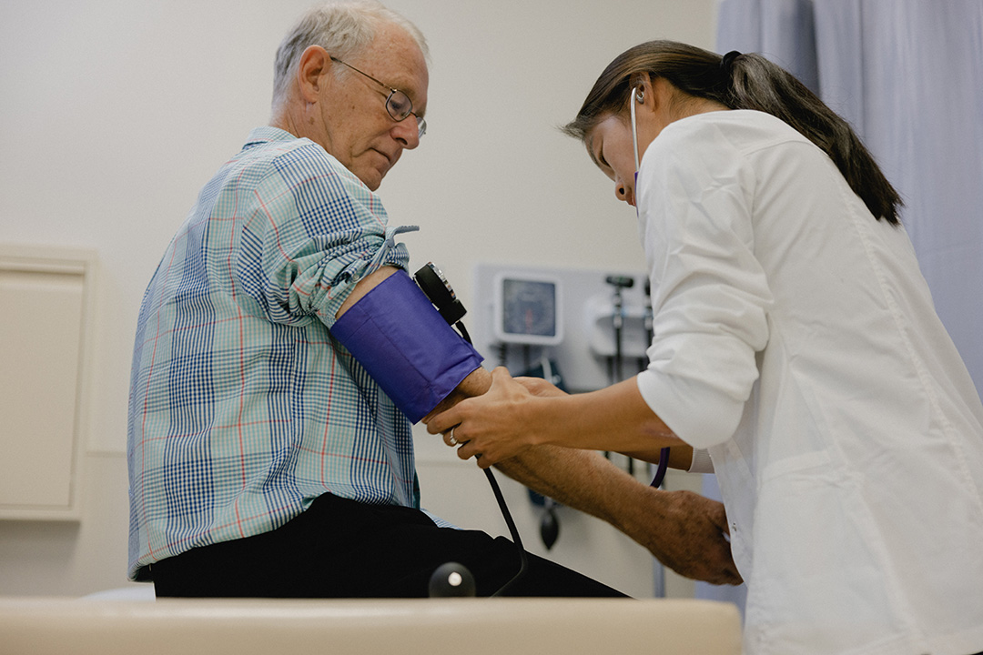 nursing student with patient