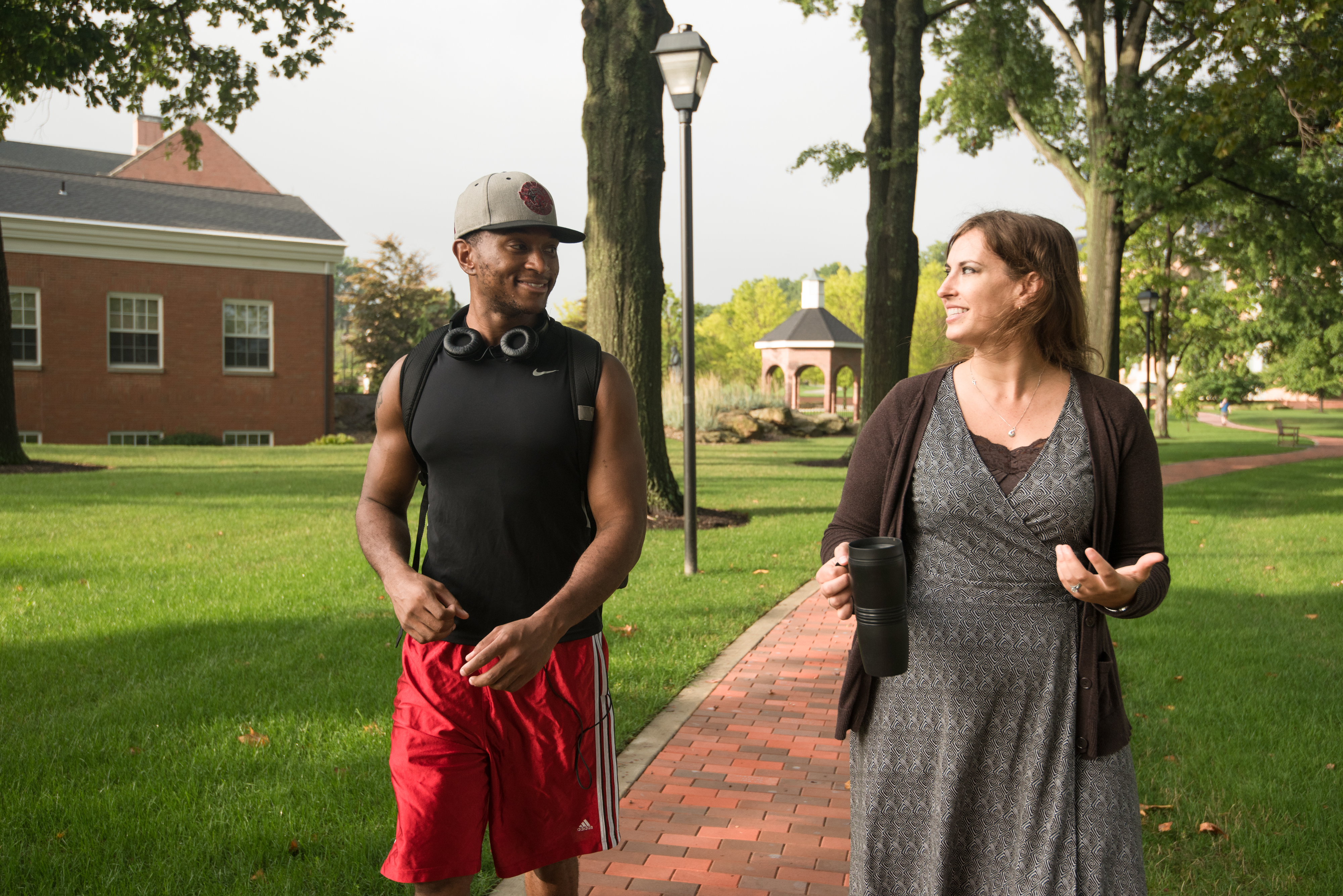 Student and Faculty member walking on campus