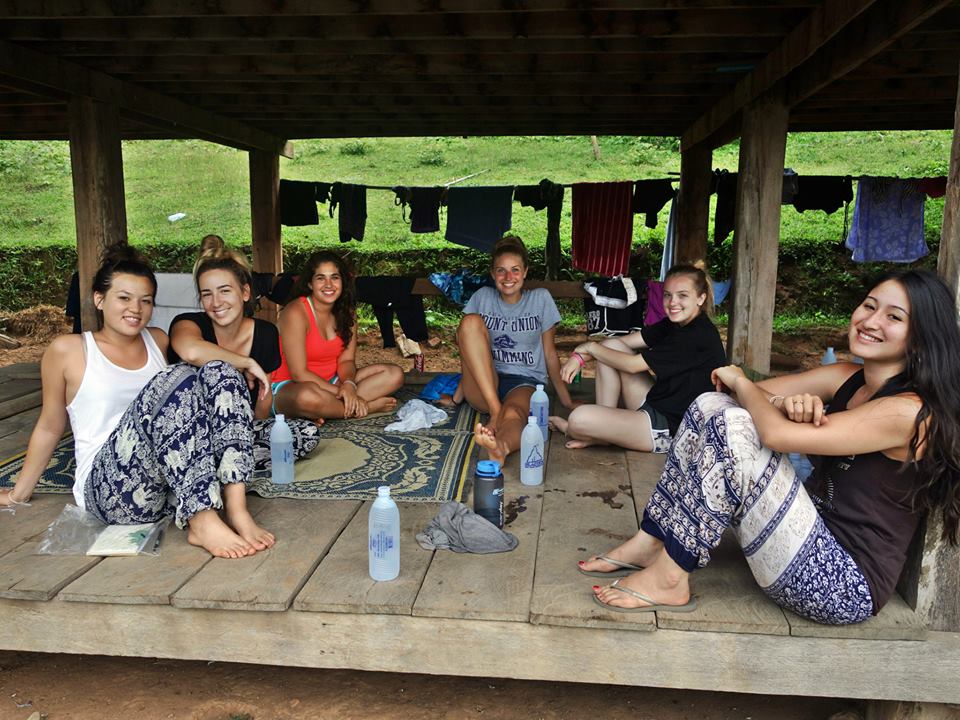 Groups of students with Thai women in rural village