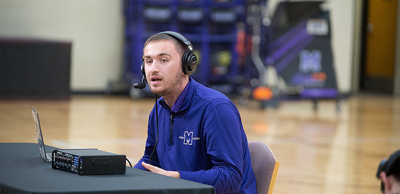 student broadcasting basketball game