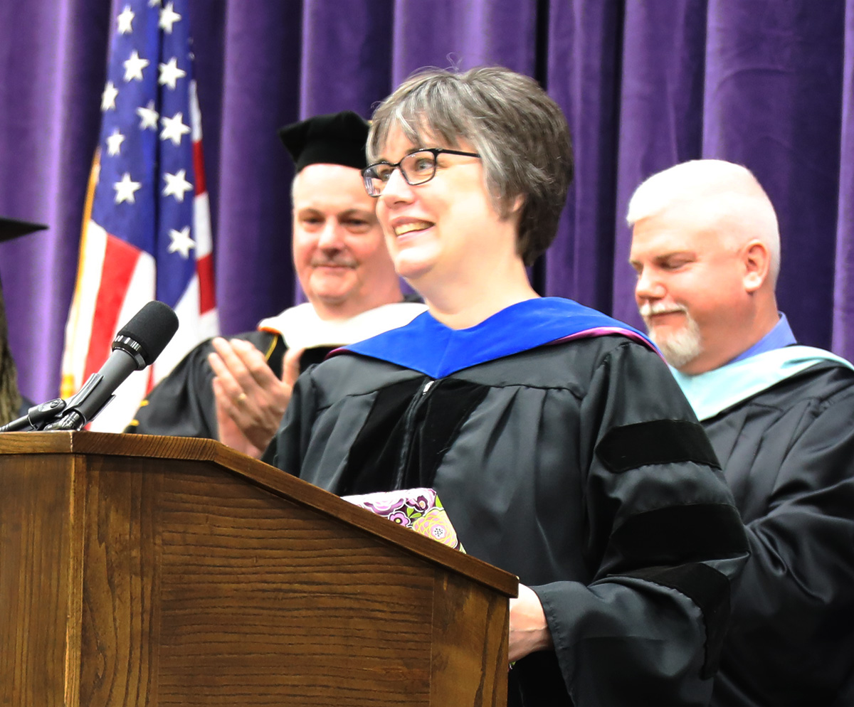 risley smiling at podium