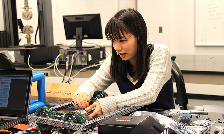 student working with wiring