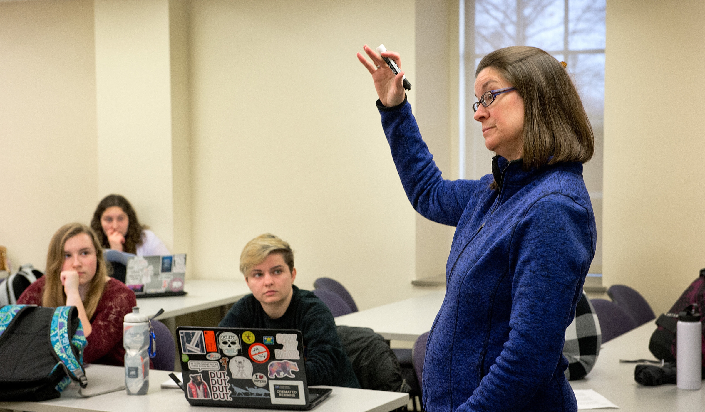 Professor teaching a class of students 