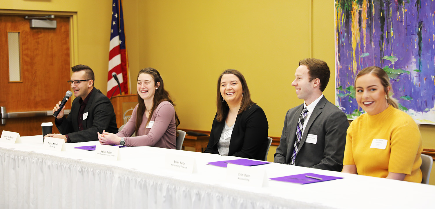 student panel smiling at questions