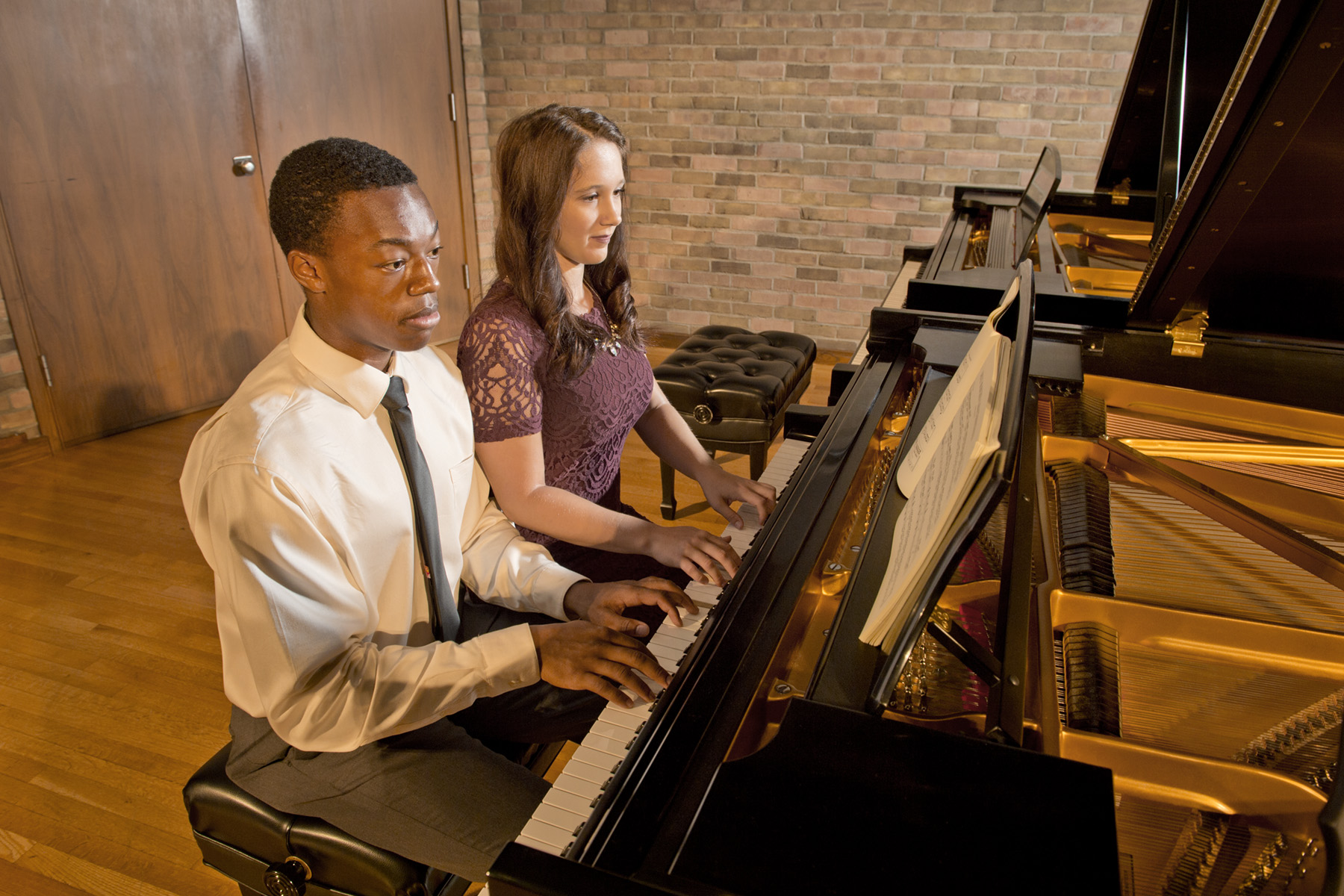 Student playing piano