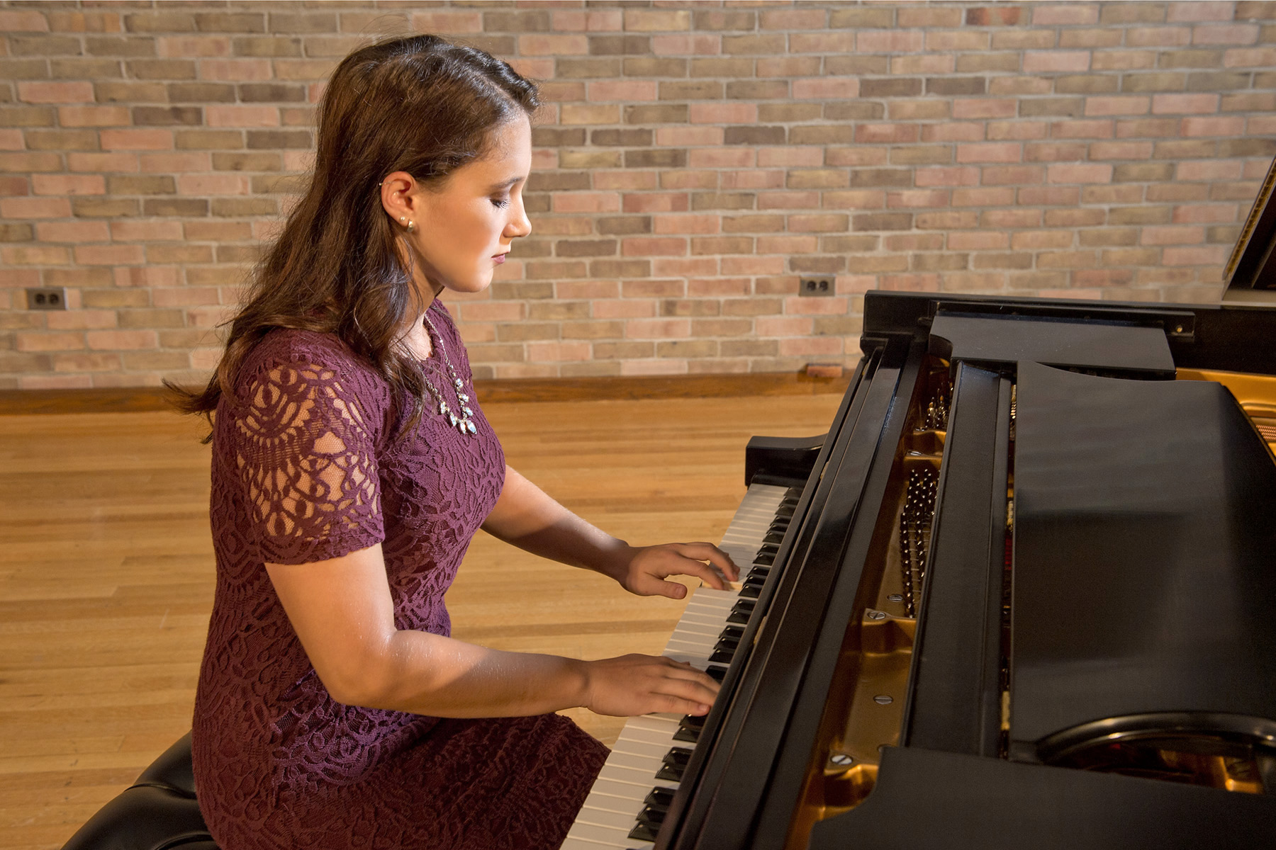 Student playing piano