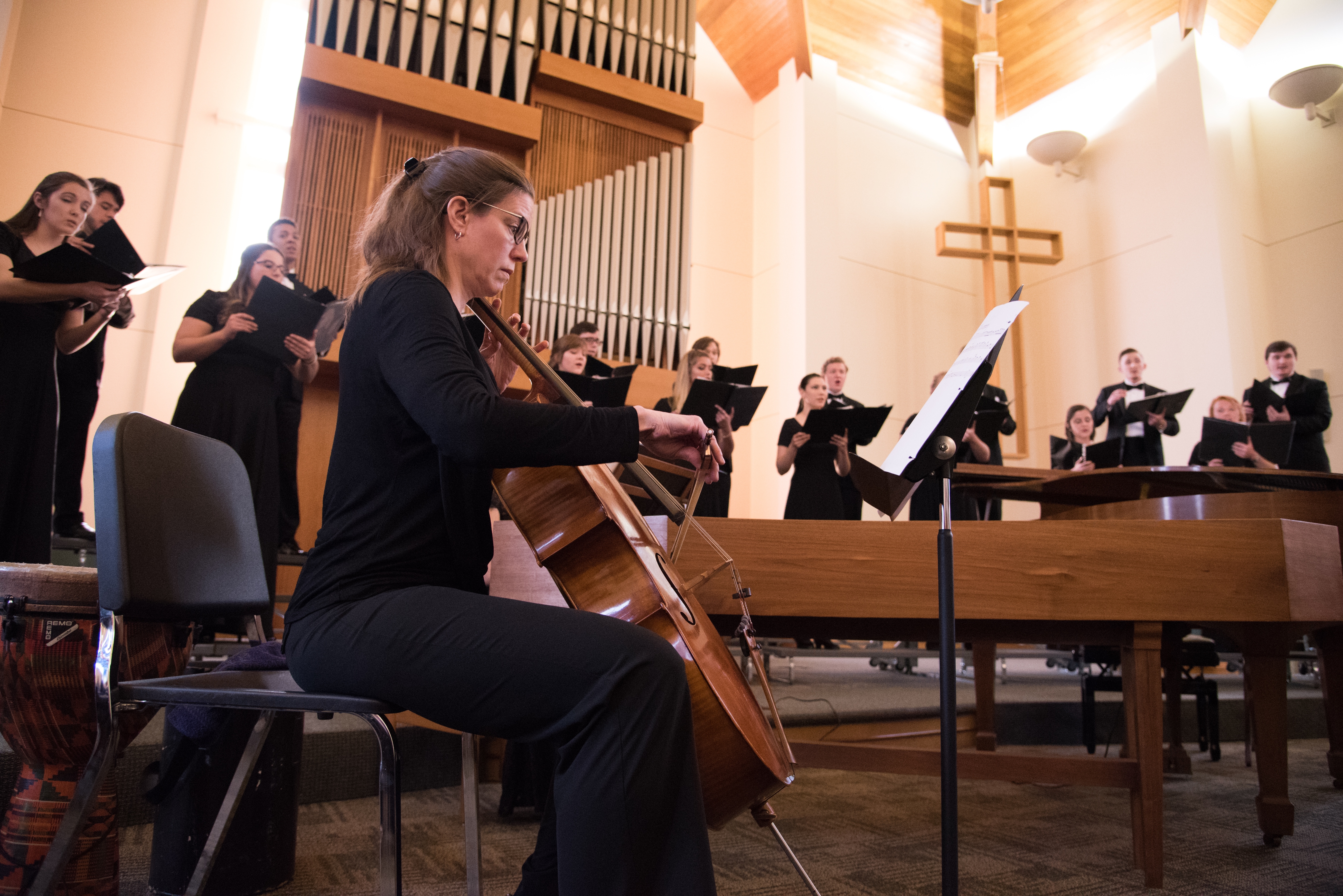 Cellist playing with choir