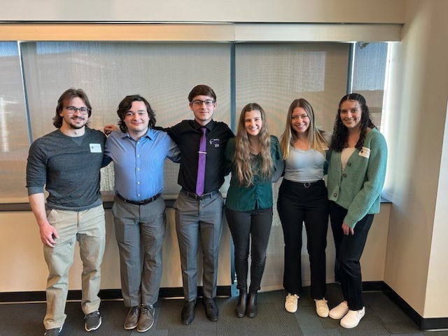 students standing at math conference