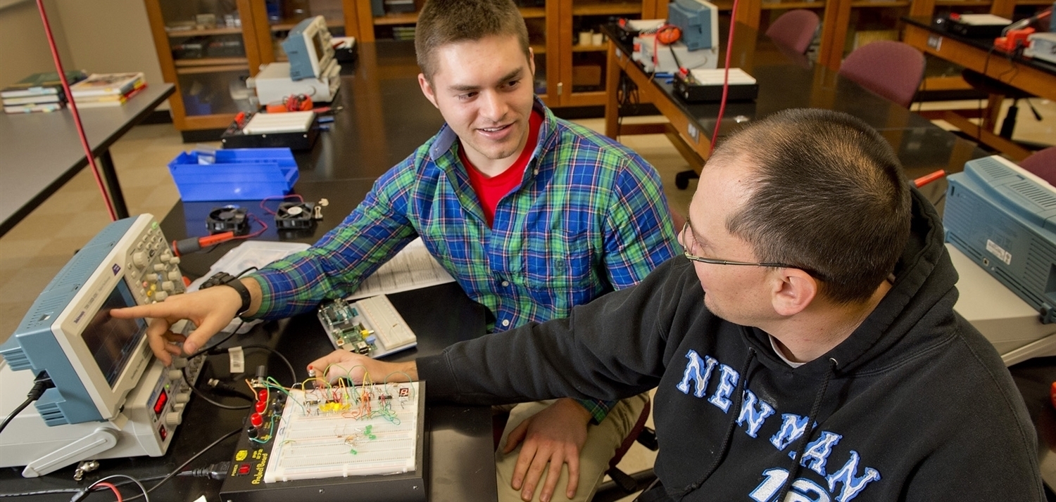 Students using electrical equipment 