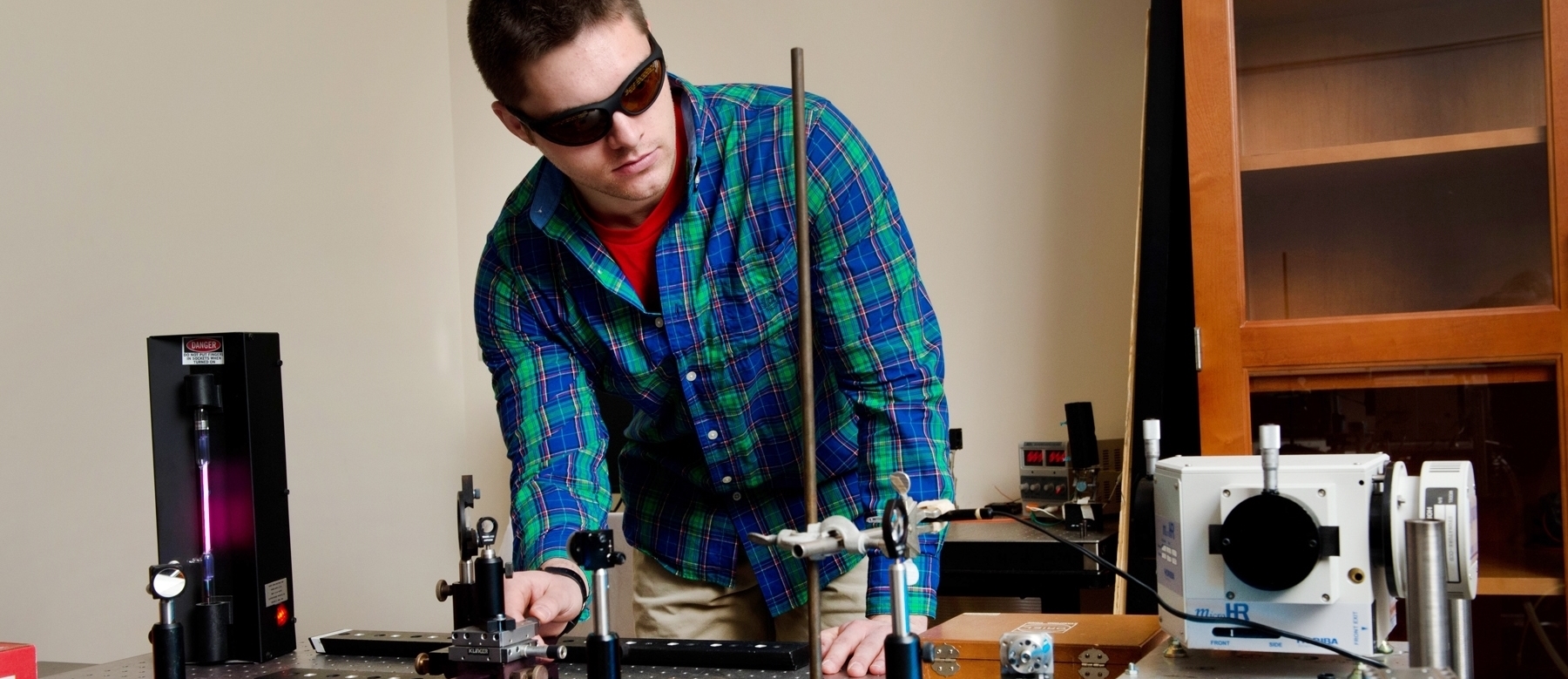 Student using laser in physics lab