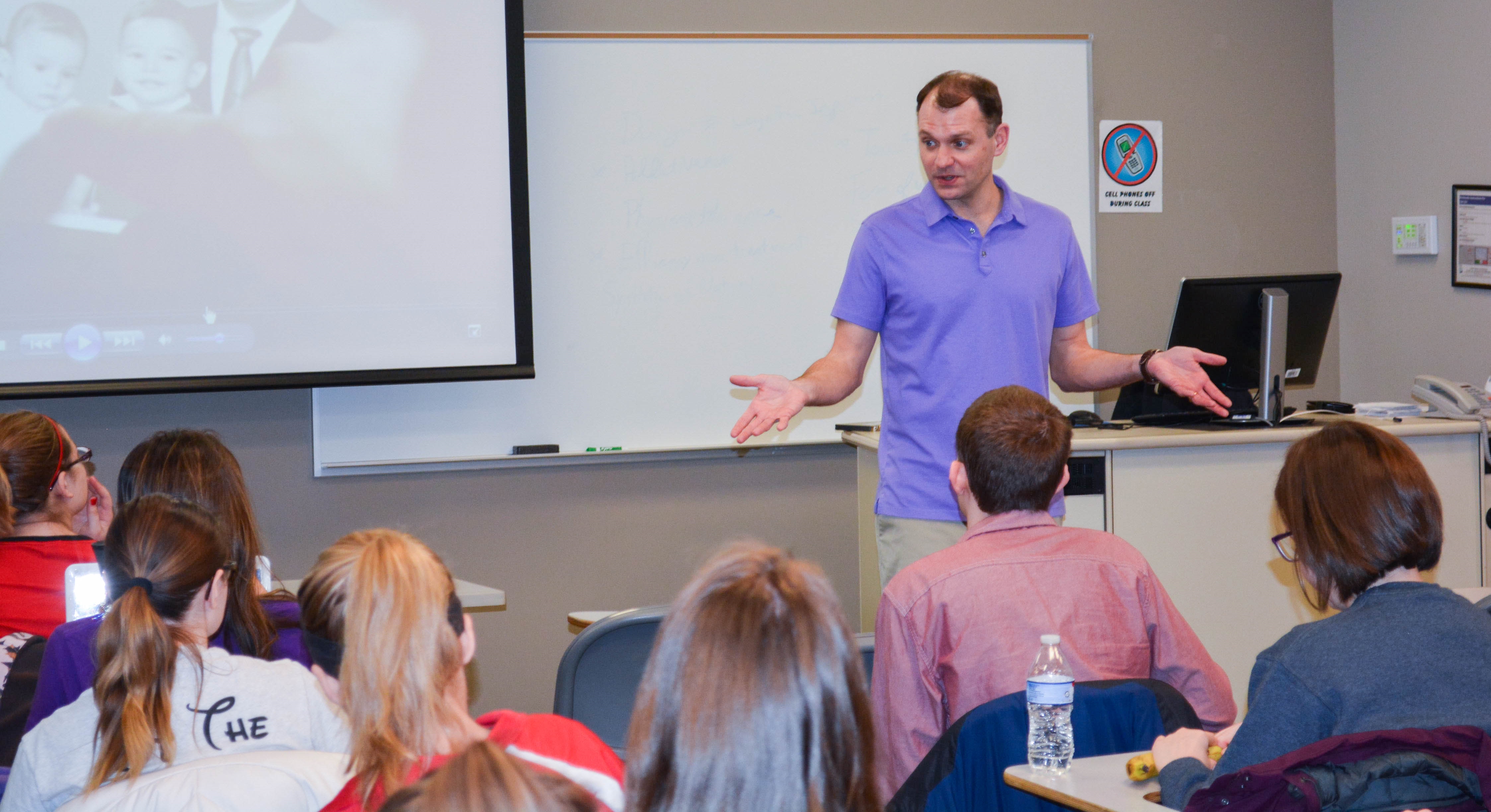 Human development and family science professor and students in a classroom 