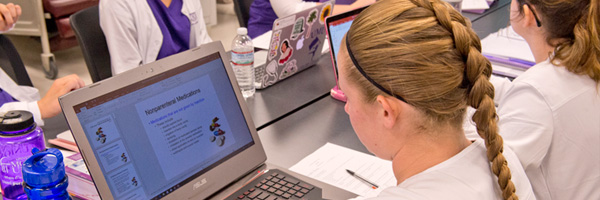 Nursing Student at computer in class