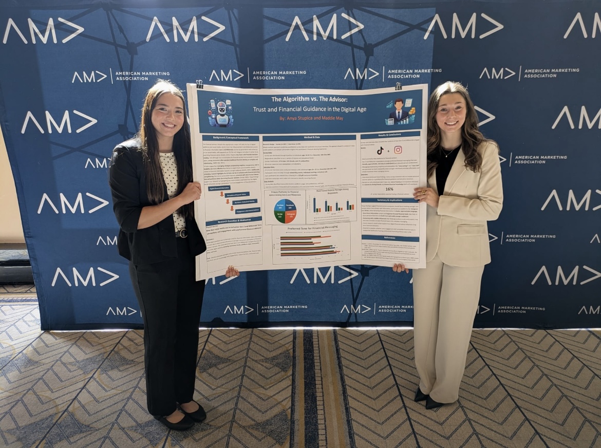 Two students presenting research