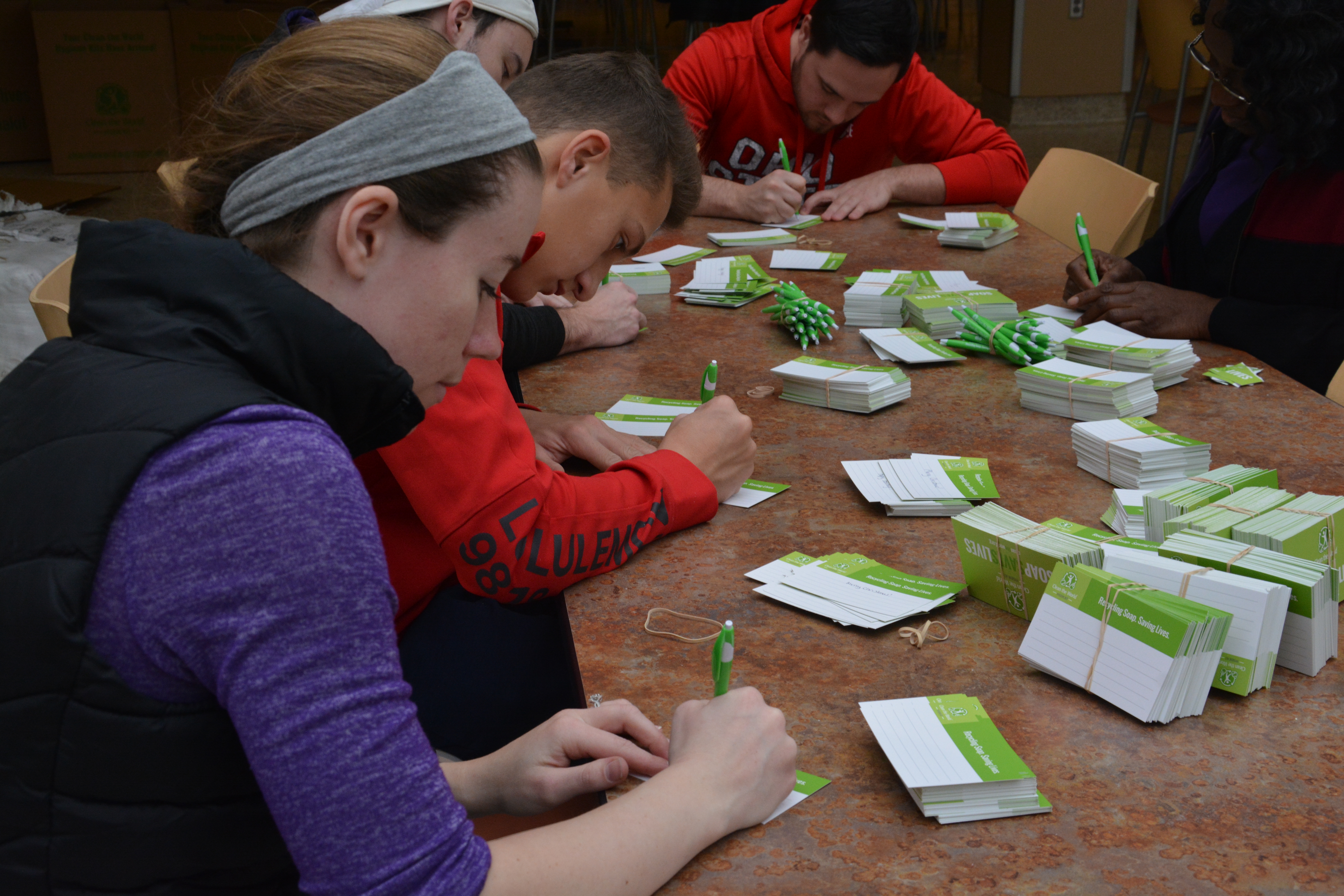 students writing on tags