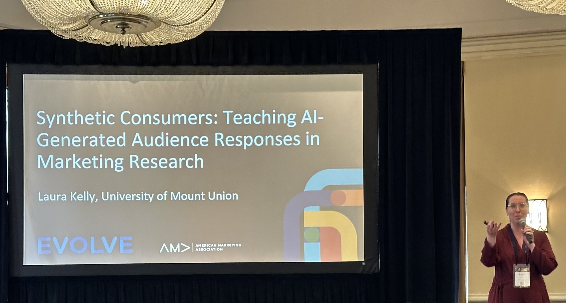 kelly presenting ai research at conference