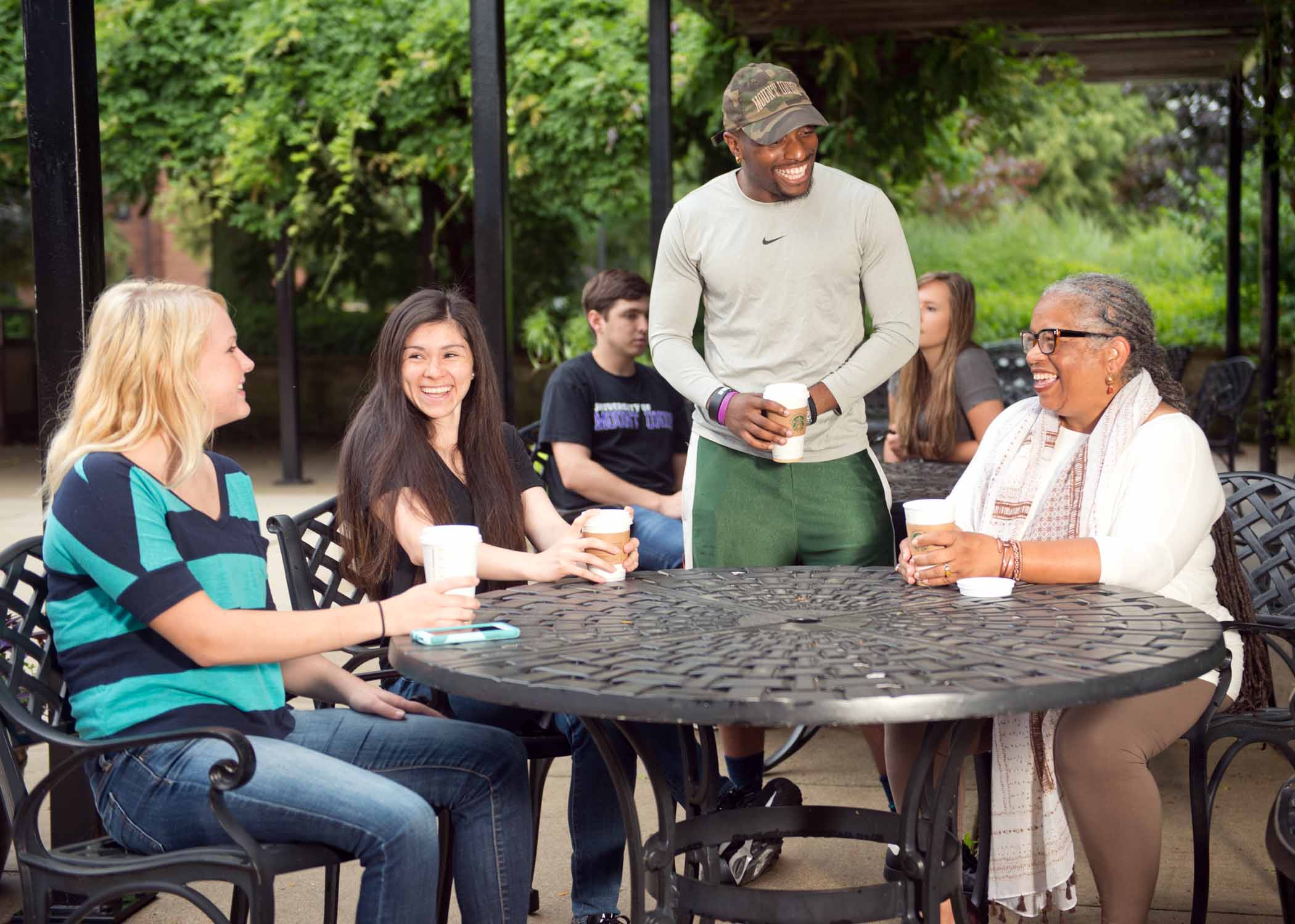 University of Mount Union students and professor on patio