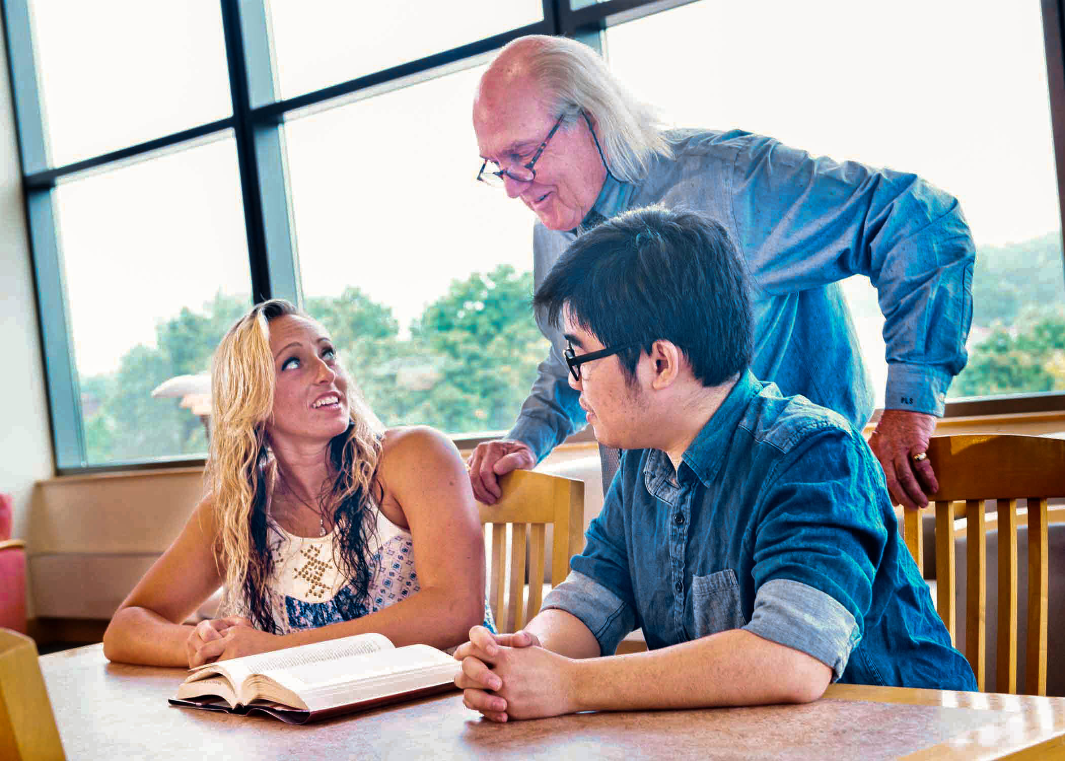 University of Mount Union students and professor in library