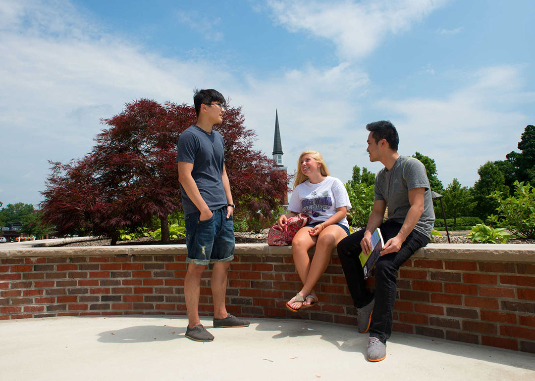 student sitting on campus