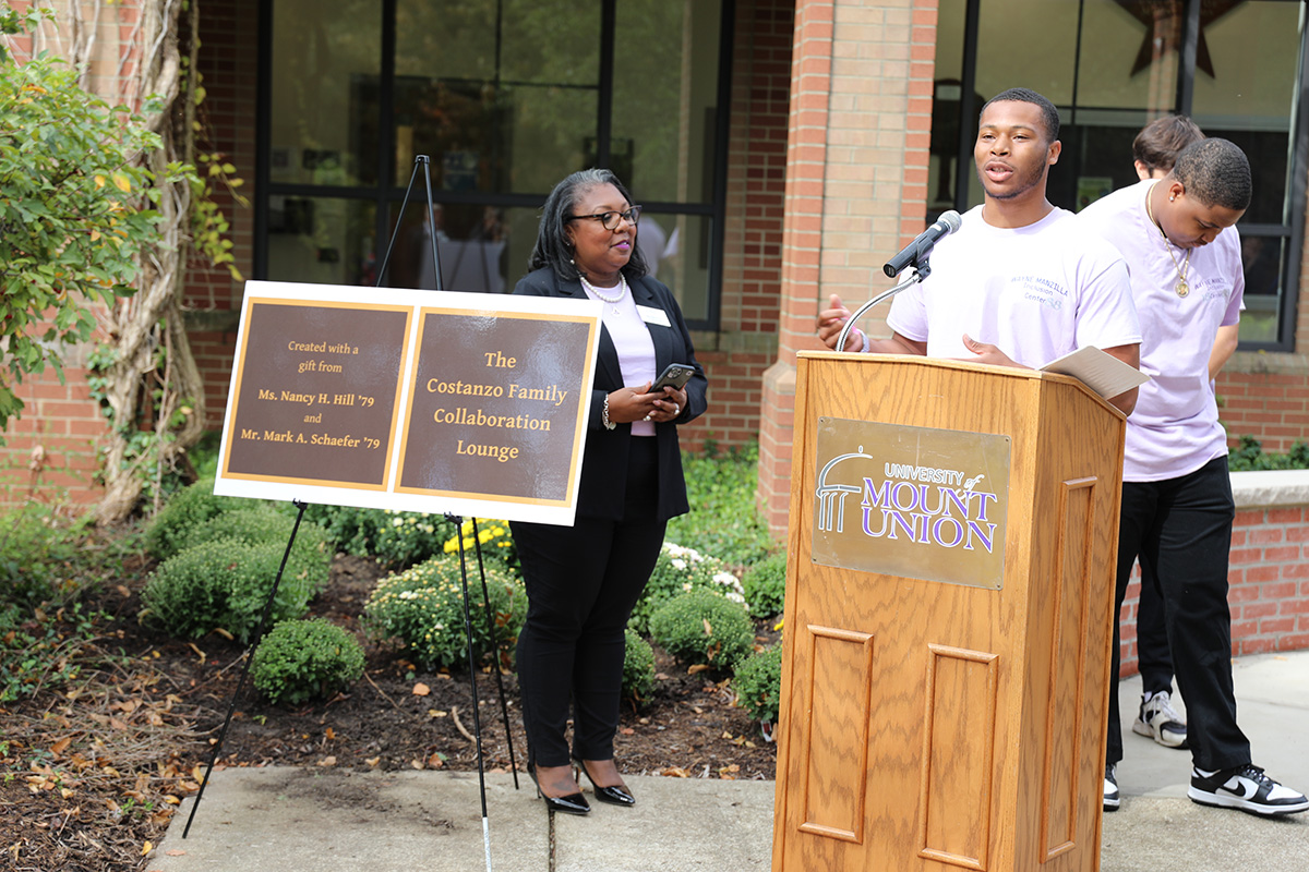 student speaking at podium