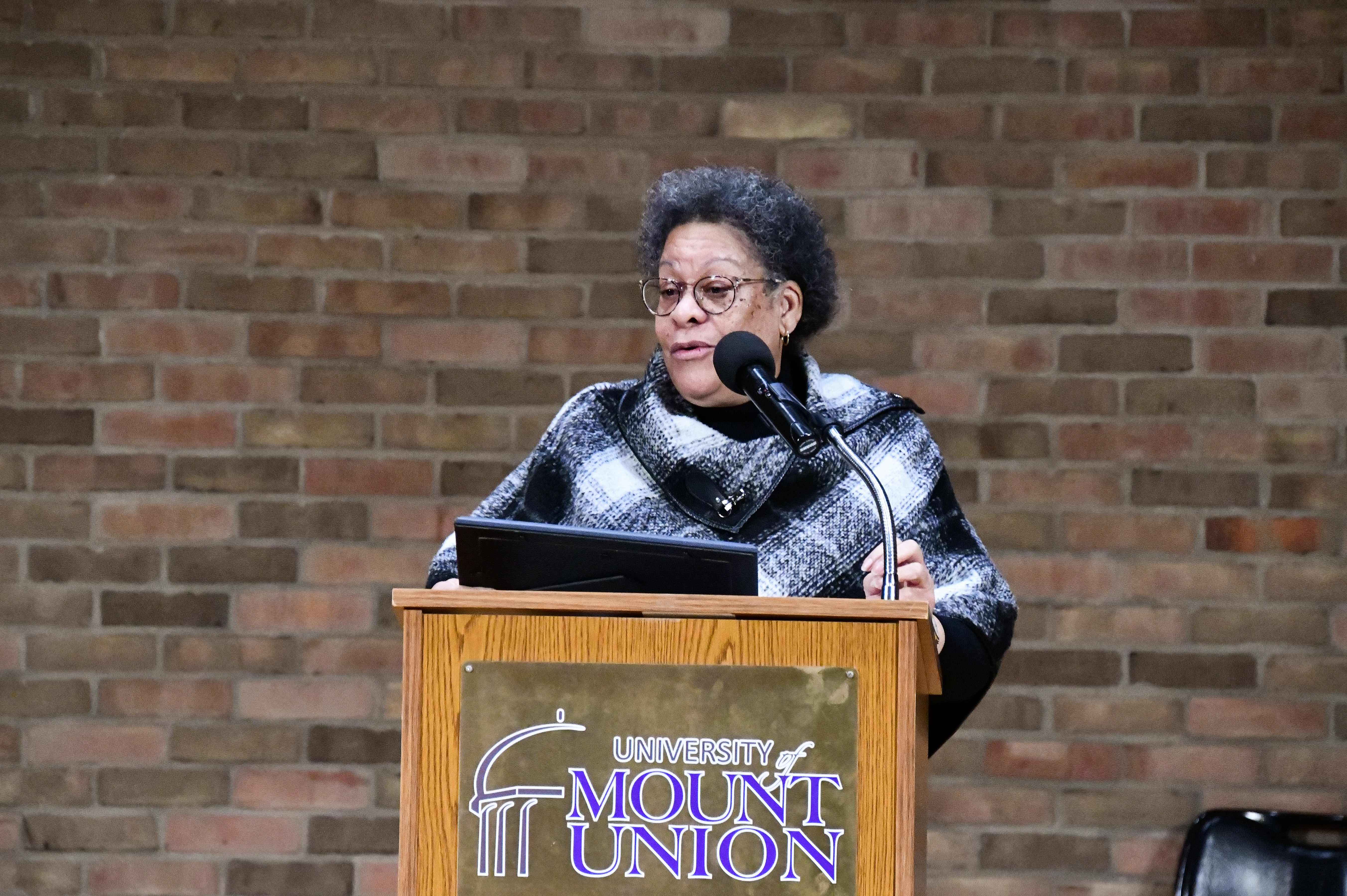 dunlap standing at podium