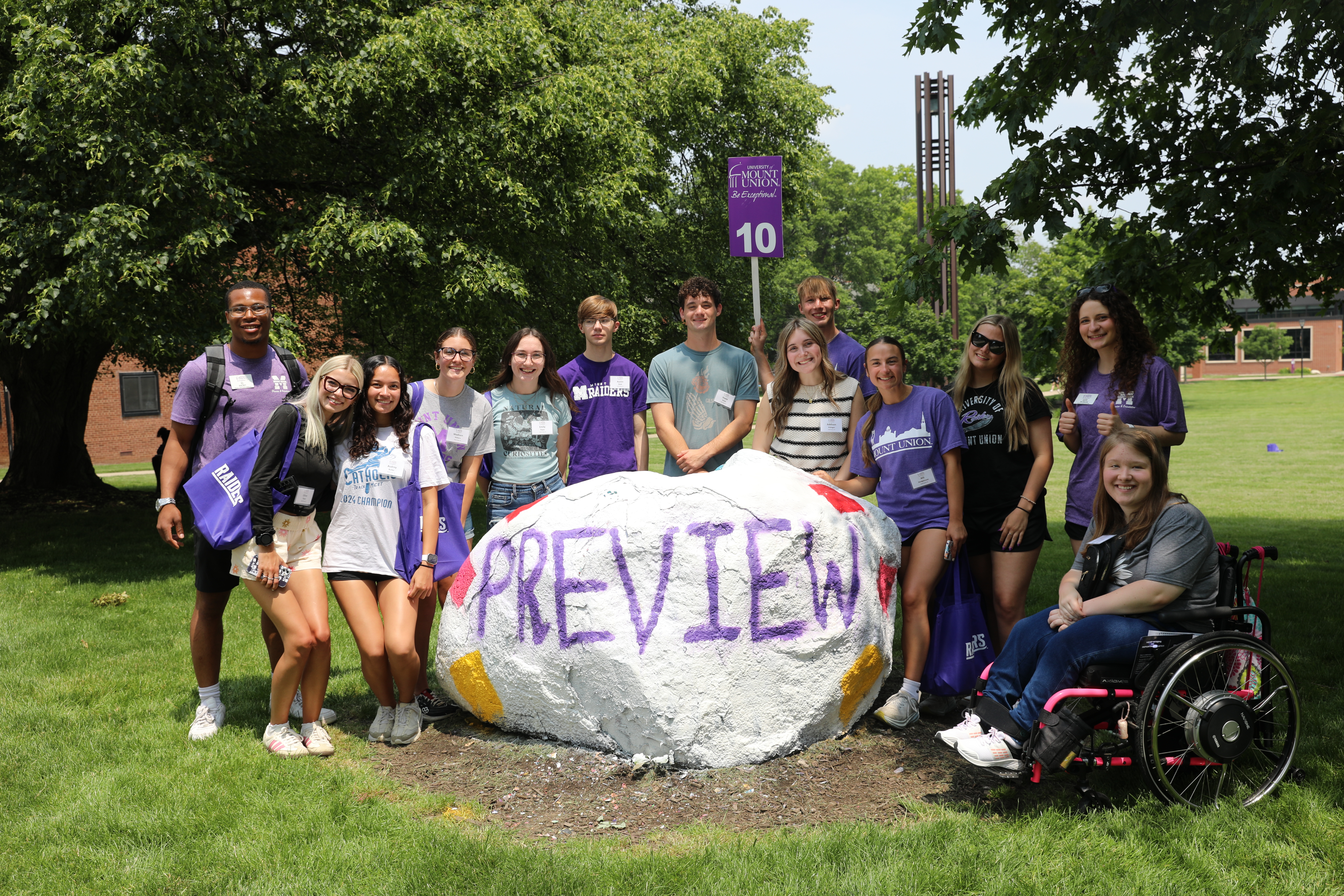 Group at Preview around decorated rock