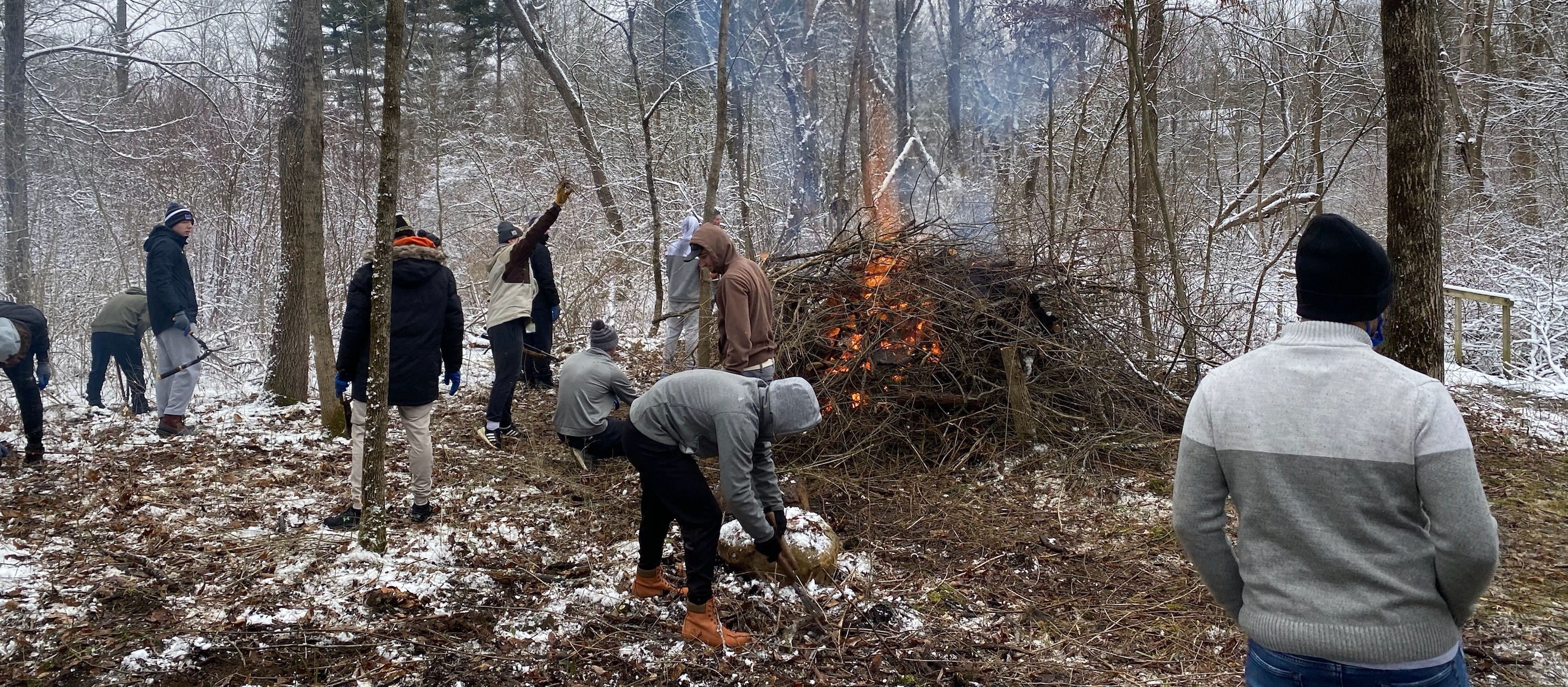 students burning brushpile