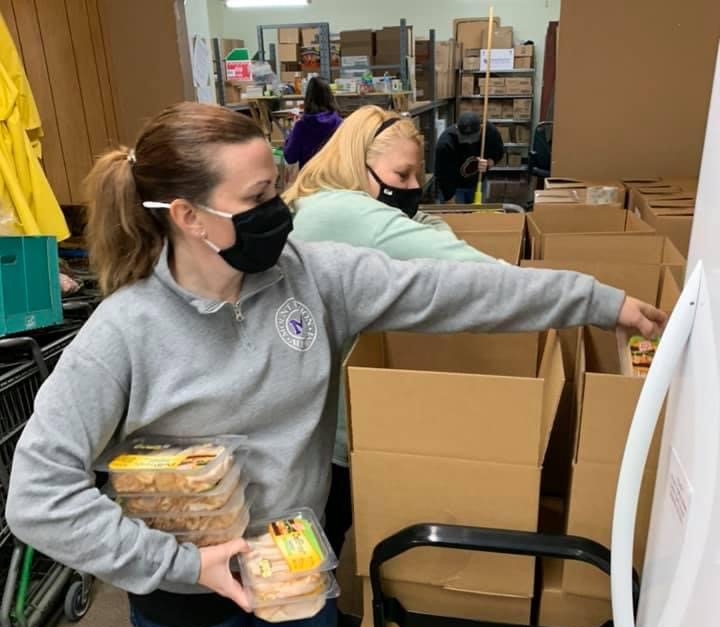 staff organizing pantry