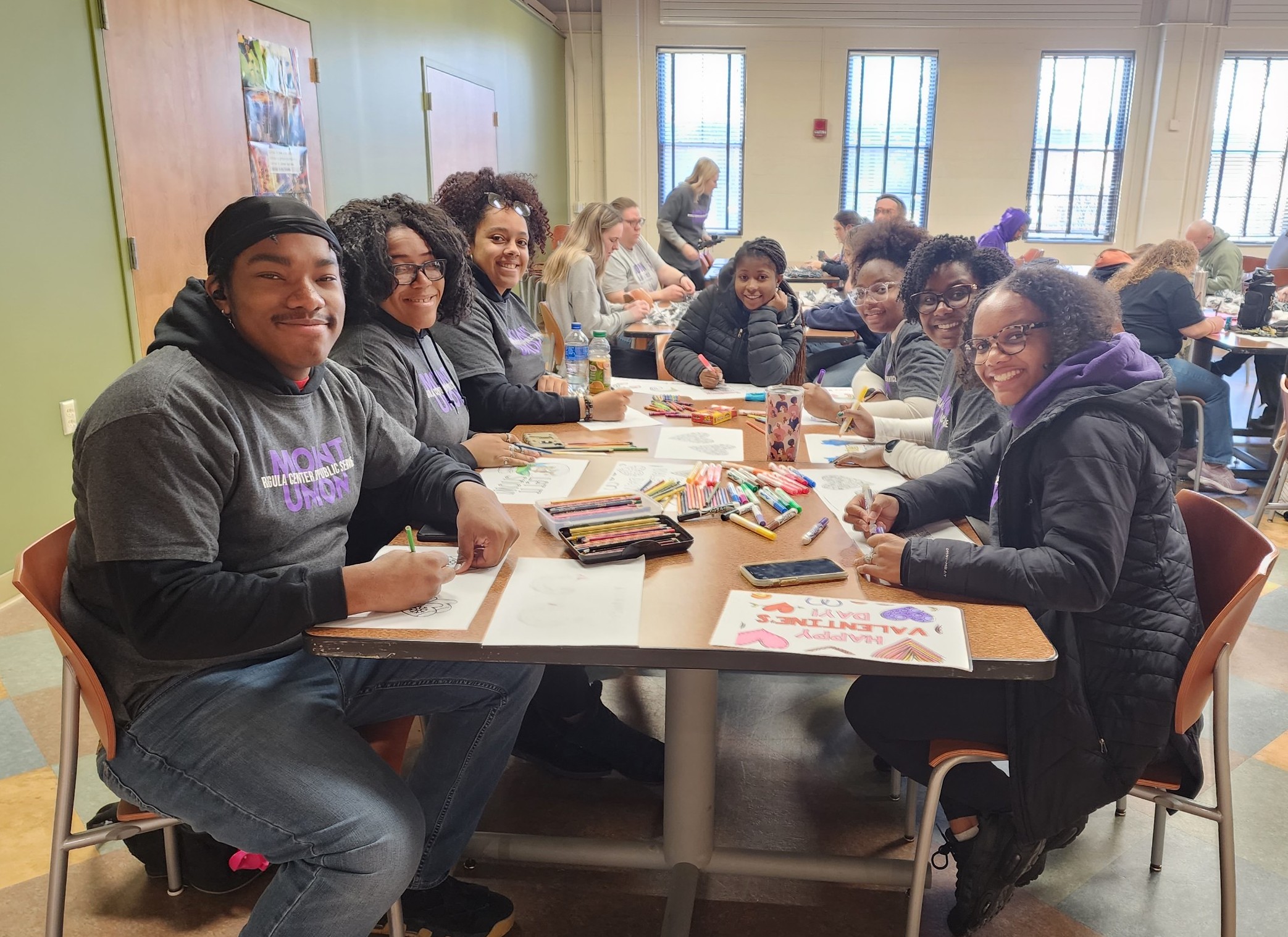 students drawing at table