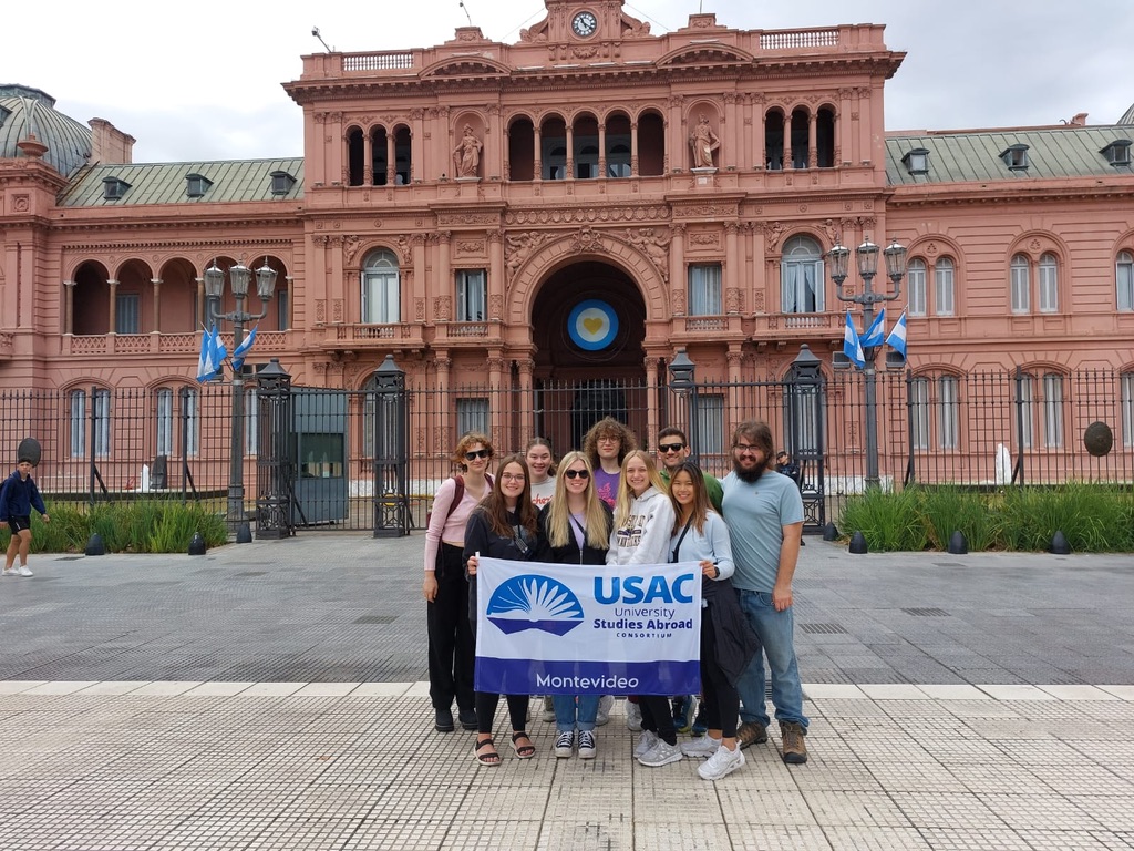 Haas '24 with a group of study abroad students