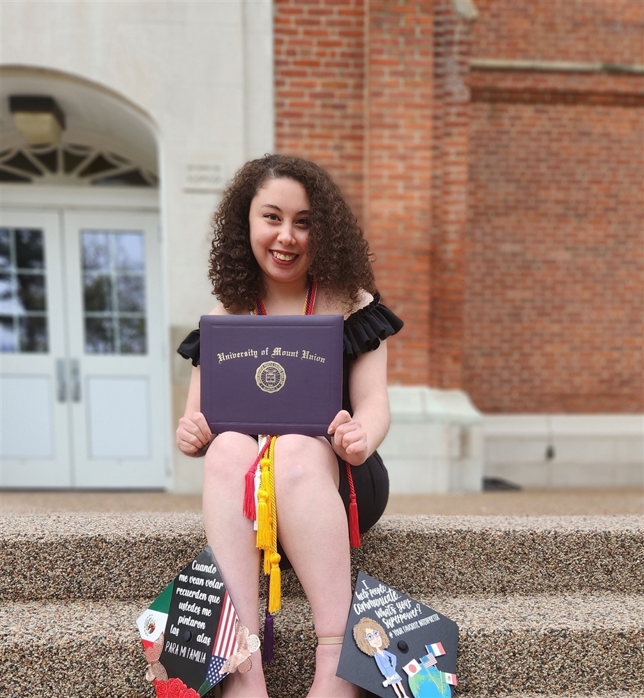 Fatima Magana with diploma