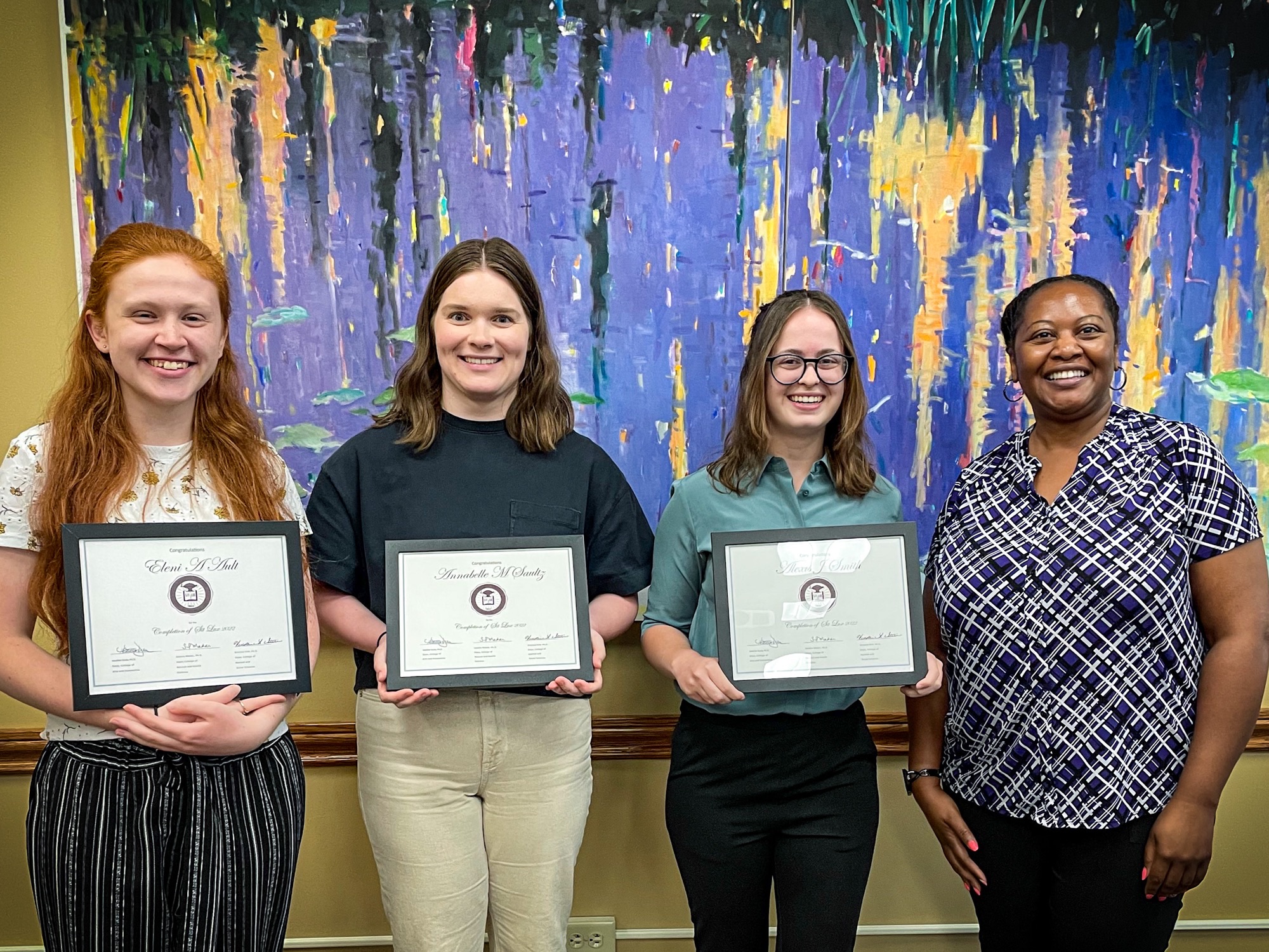 From L to R: Eleni Ault, Annabelle Saultz. Lexi Smith, and Carla Sarratt (Director of Library Services at the University of Mount Union)