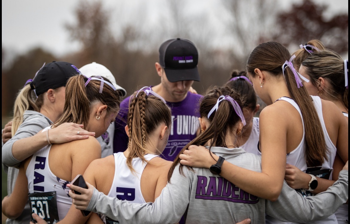 Mount Union track team in huddle