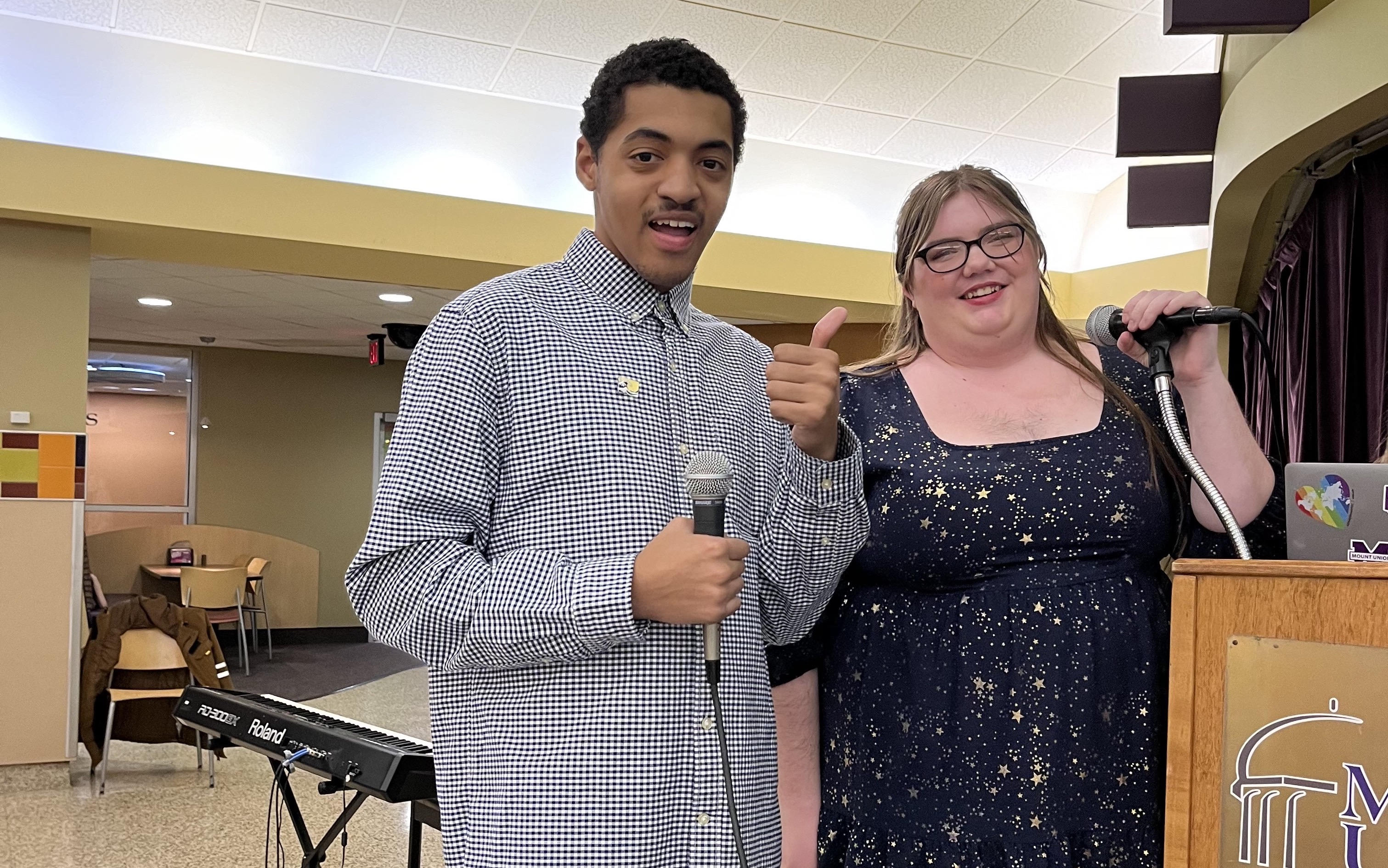 Two students with microphones