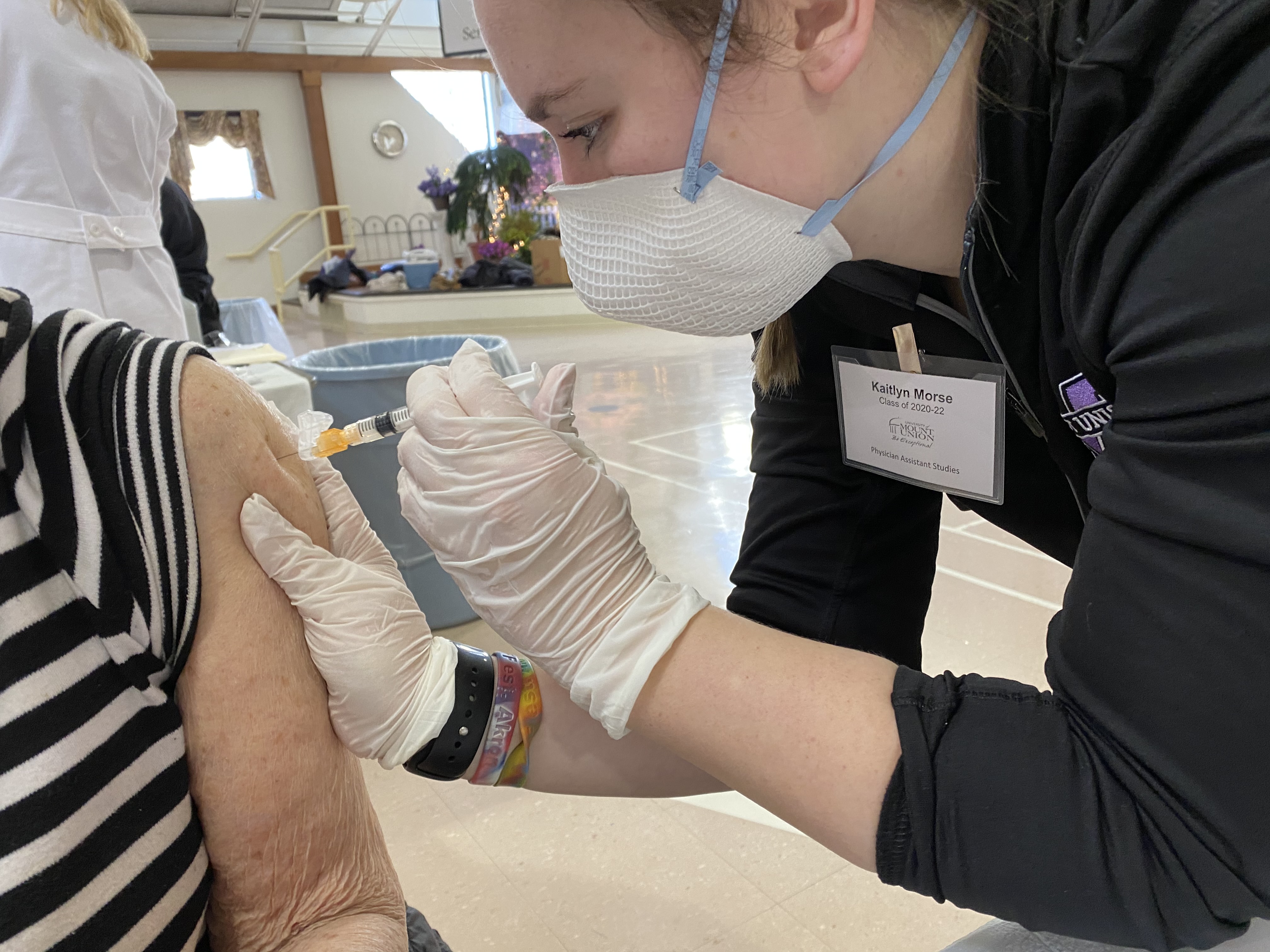 woman injecting vaccine