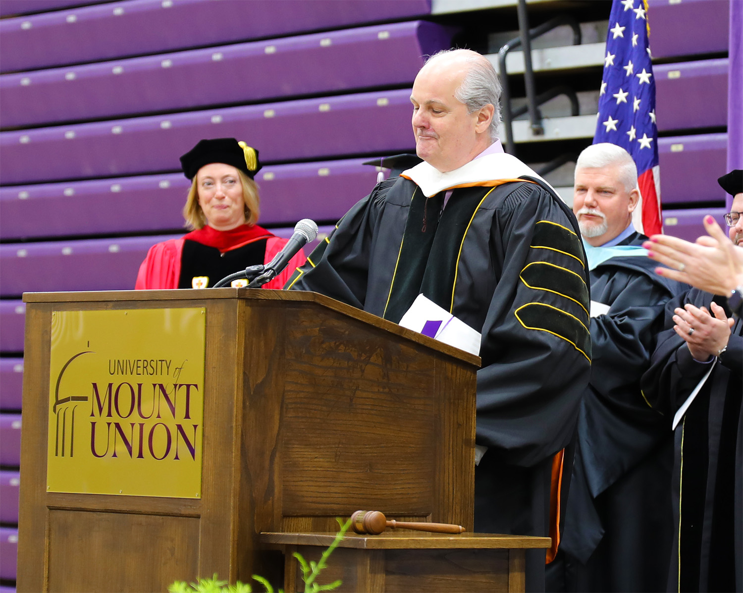 Andrew Price at podium accepting Great Teacher Award