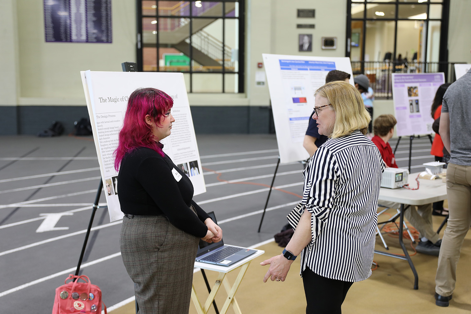 woman talking with female student